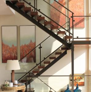 Indoor metal stringer stair with wood treads and glass balustrade
