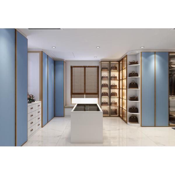 Blue Walk In Closet With Integrated Central Island Seamless Functionality