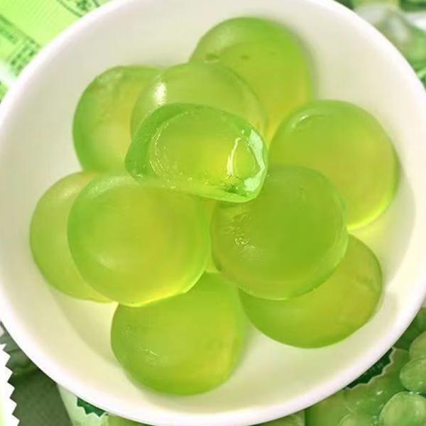 Flavored peelable candy filled gummy balls in bottle packaging