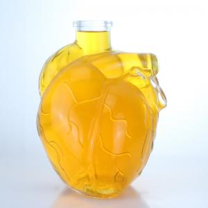 China Clear or Customized Heart Shape Glass Liquor Bottle for Beverage Whisky Vodka Brandy on sale
